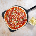 Fior di latte mozzarella cheese, cubed, shown on pizza with diced toppings