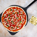 Julienne-style mozzarella cheese topping, shredded form with grated pieces in small dish