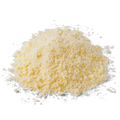 Grated hard vegetarian cheese, pale yellow cheese flakes pile