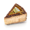 OCCELLI cheese wedge with whisky and barley malt label, rustic dark rind