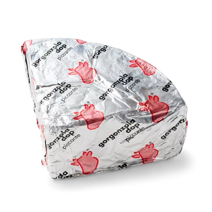 Wrapped gorgonzola piccante PDO cheese in foil with red heart print